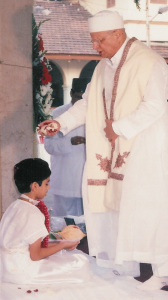 Ordained priest minister initiates boy into Zoroastrian church